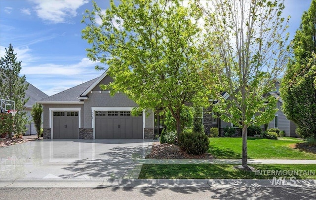 3345 W Dublin St, Eagle, ID 83616 - obstructed view of property with stone siding, a garage, concrete driveway, and a front lawn