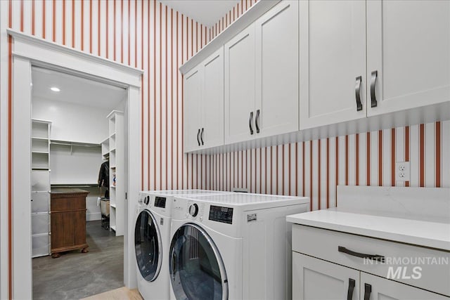 3345 W Dublin St, Eagle, ID 83616 - laundry area featuring wallpapered walls, cabinet space, and washer and clothes dryer