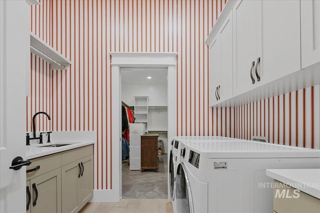 3345 W Dublin St, Eagle, ID 83616 - washroom with wallpapered walls, cabinet space, and independent washer and dryer
