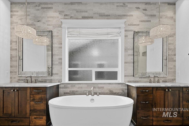 3345 W Dublin St, Eagle, ID 83616 - bathroom featuring two vanities and a soaking tub