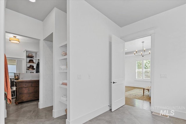 3345 W Dublin St, Eagle, ID 83616 - corridor with a chandelier, built in features, and baseboards