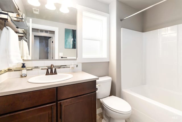 full bathroom featuring shower / bath combination, tasteful backsplash, visible vents, toilet, and vanity