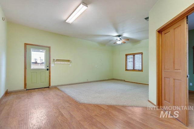 unfurnished room featuring ceiling fan and light hardwood / wood-style floors