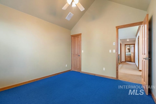 unfurnished bedroom featuring carpet, ceiling fan, and high vaulted ceiling