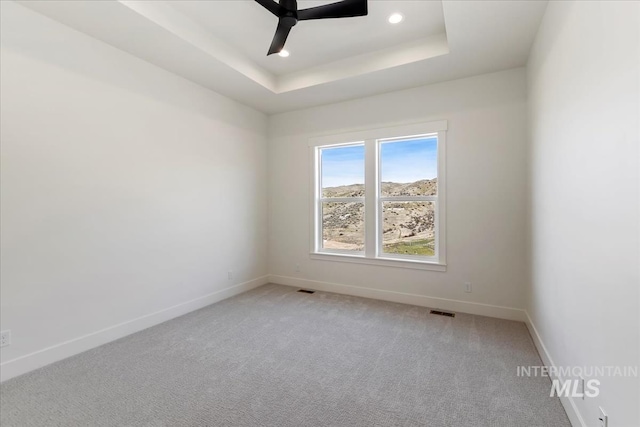 6535 S Evie Way, Eagle, ID 83714 - unfurnished room with baseboards, a raised ceiling, ceiling fan, light colored carpet, and recessed lighting