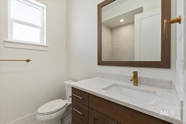6535 S Evie Way, Eagle, ID 83714 - bathroom with vanity, toilet, and baseboards