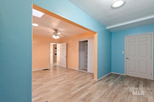 120 W Main St, Hagerman, ID 83332 - foyer entrance with a textured ceiling, light hardwood / wood-style floors, and ceiling fan