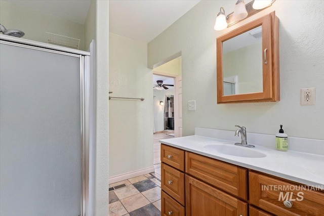 120 W Main St, Hagerman, ID 83332 - bathroom with tile patterned floors, vanity, ceiling fan, and an enclosed shower