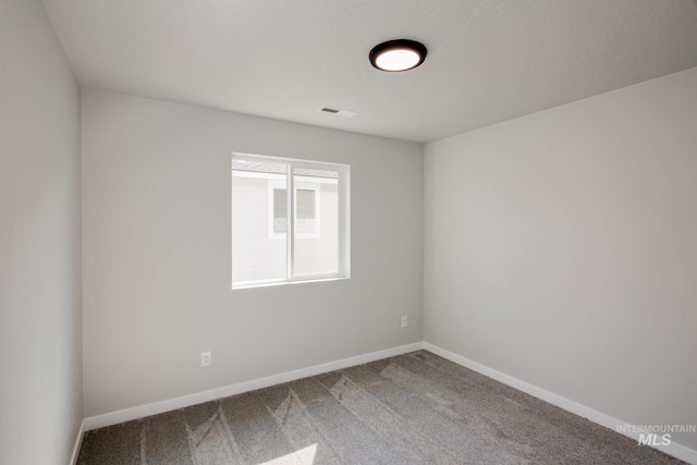 empty room featuring carpet flooring