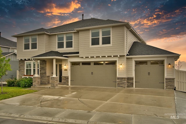 10449 W Thimbleberry Dr, Star, ID 83669 - view of front of house with stone siding, driveway, a garage, and a shingled roof