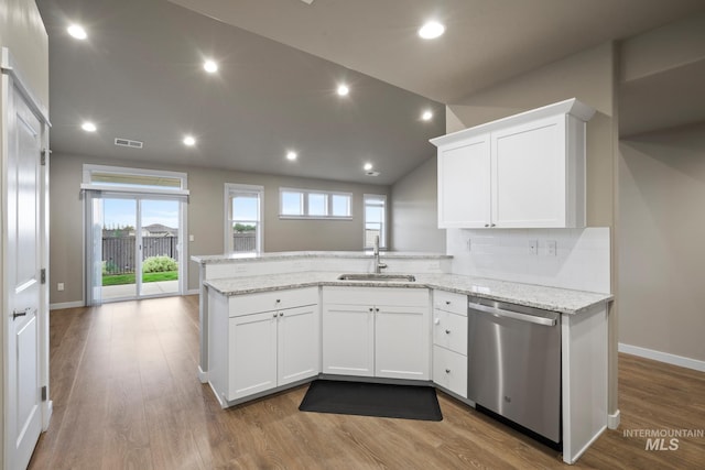 10449 W Thimbleberry Dr, Star, ID 83669 - kitchen featuring stainless steel dishwasher, a peninsula, white cabinets, plenty of natural light, and recessed lighting