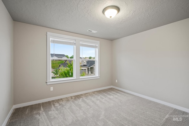 10449 W Thimbleberry Dr, Star, ID 83669 - spare room with carpet flooring and a textured ceiling