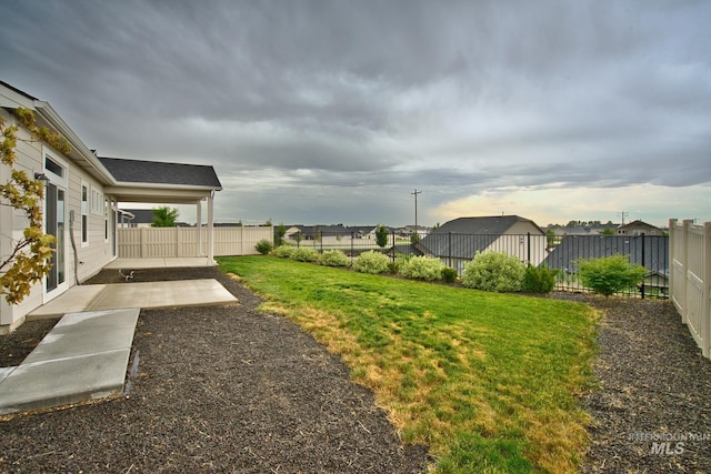 10449 W Thimbleberry Dr, Star, ID 83669 - fenced backyard with a patio area