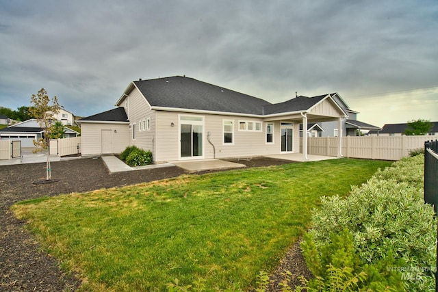 10449 W Thimbleberry Dr, Star, ID 83669 - back of property with a patio area and a shingled roof