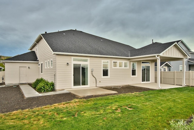 10449 W Thimbleberry Dr, Star, ID 83669 - rear view of property featuring a patio, board and batten siding, and roof with shingles