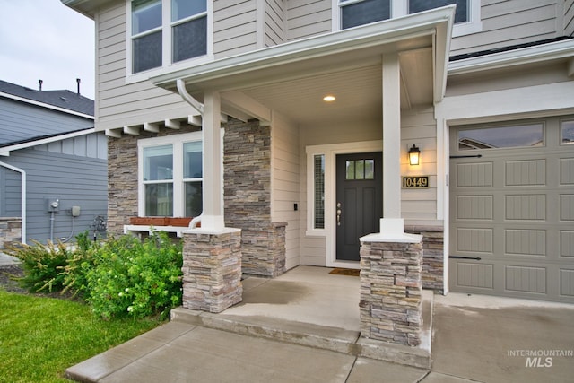 10449 W Thimbleberry Dr, Star, ID 83669 - doorway to property featuring covered porch and stone siding
