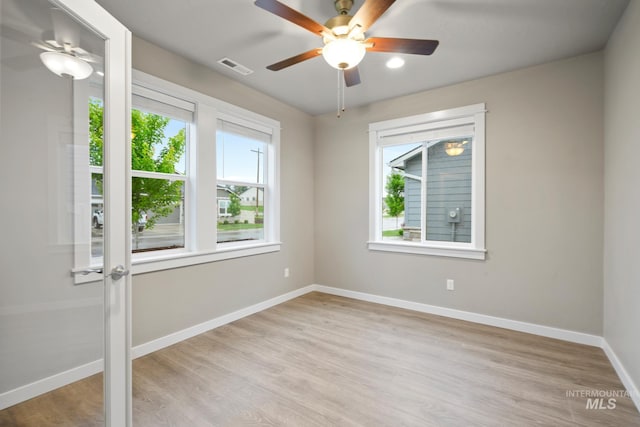 10449 W Thimbleberry Dr, Star, ID 83669 - unfurnished room with healthy amount of natural light, light wood-style floors, and ceiling fan