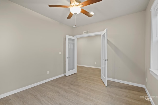 10449 W Thimbleberry Dr, Star, ID 83669 - unfurnished room with french doors, light wood-style floors, and ceiling fan