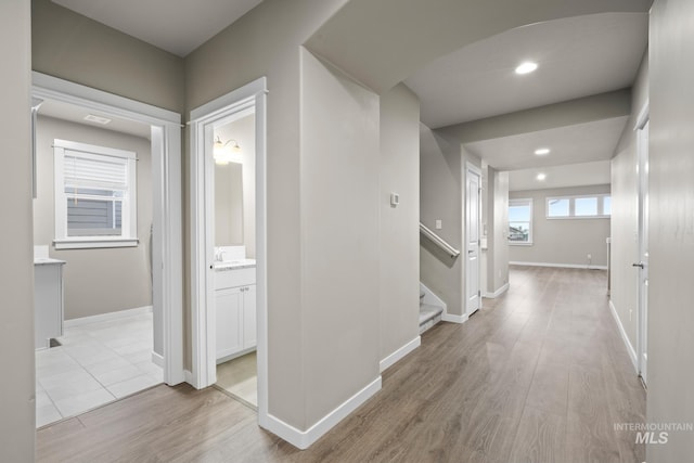 10449 W Thimbleberry Dr, Star, ID 83669 - hallway featuring light wood finished floors, stairway, and recessed lighting