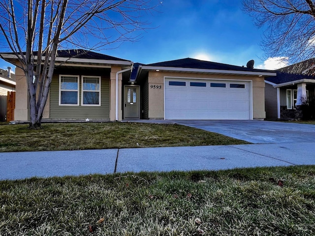 view of front facade featuring a garage and a front lawn