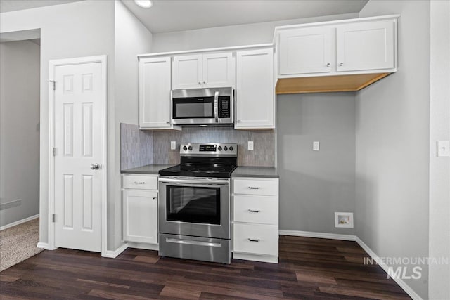 kitchen with white cabinets and appliances with stainless steel finishes