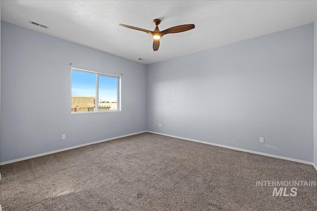 carpeted empty room with ceiling fan