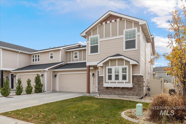 view of front of house with a garage and a front lawn