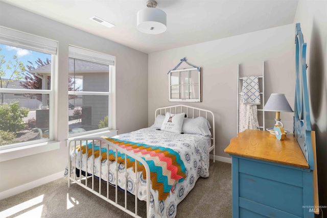 bedroom with carpet and baseboards