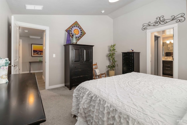 bedroom featuring vaulted ceiling, light colored carpet, and baseboards