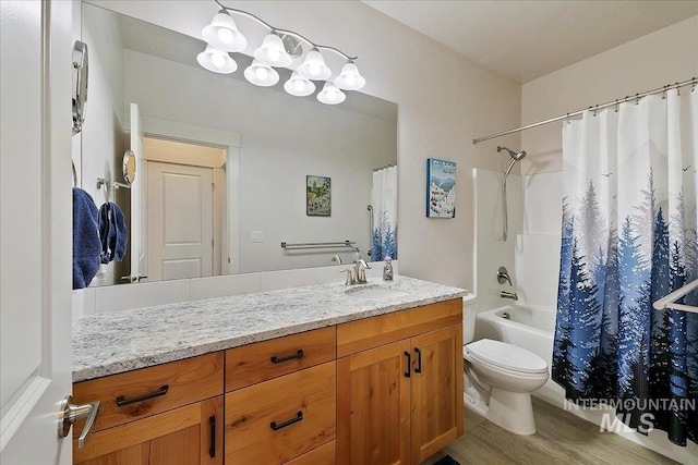 full bathroom featuring shower / bathtub combination with curtain, toilet, wood finished floors, and vanity