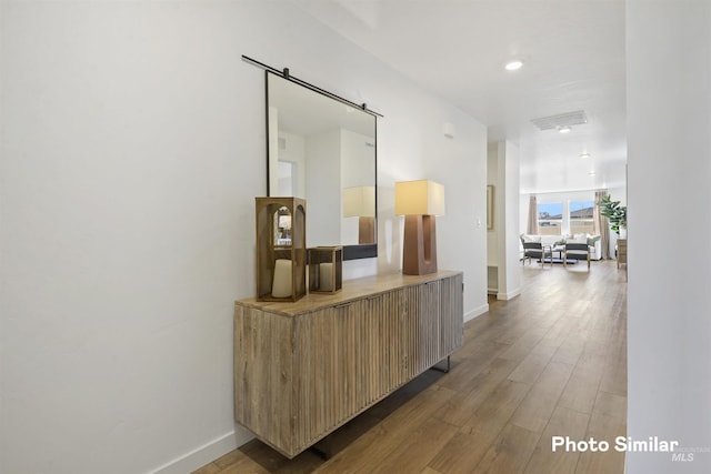 hall with hardwood / wood-style floors