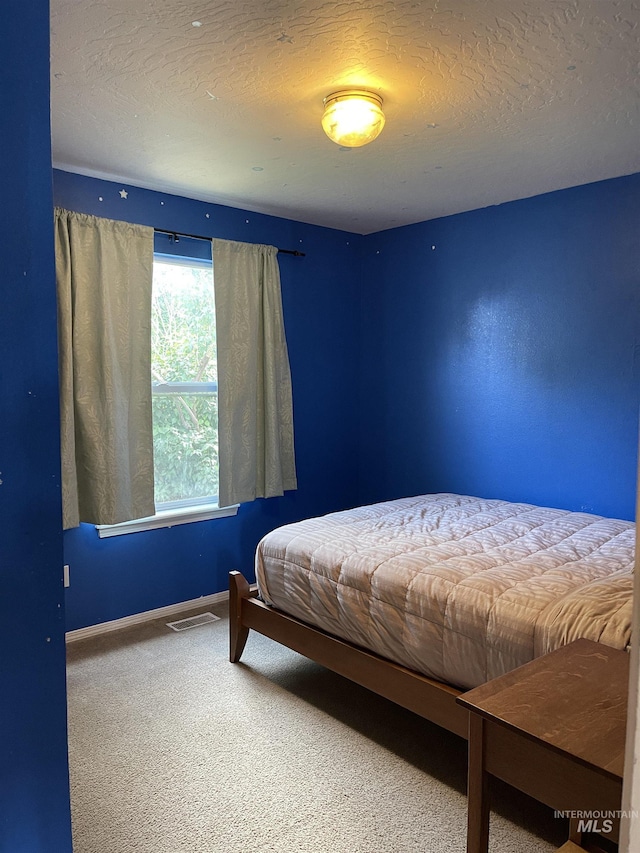 14285 Shenandoah St, Caldwell, ID 83607 - bedroom featuring carpet floors and a textured ceiling