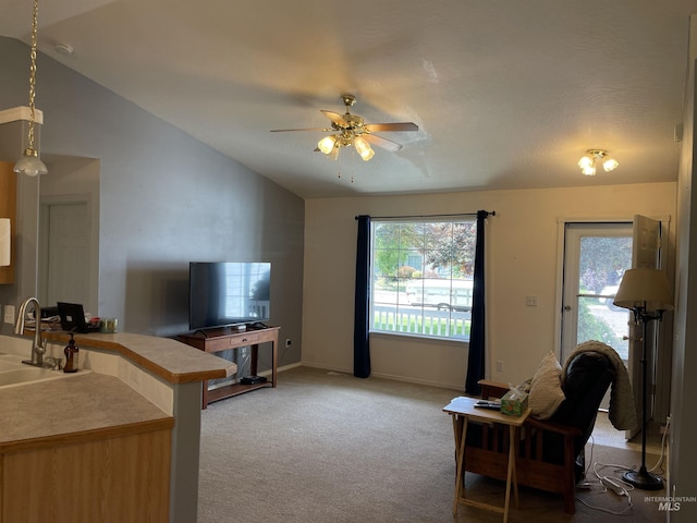 14285 Shenandoah St, Caldwell, ID 83607 - living area with ceiling fan, light carpet, and lofted ceiling