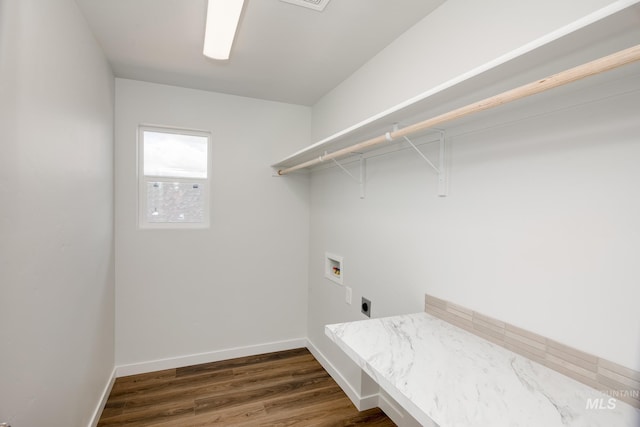 clothes washing area featuring hookup for a washing machine, baseboards, hookup for an electric dryer, laundry area, and dark wood-style flooring