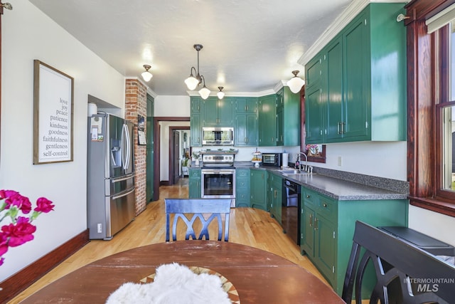 133 N Rd, Jerome, ID 83338 - kitchen with dark countertops, green cabinets, appliances with stainless steel finishes, and a sink
