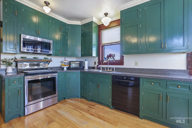 133 N Rd, Jerome, ID 83338 - kitchen with light wood finished floors, stainless steel appliances, dark countertops, ornamental molding, and a sink