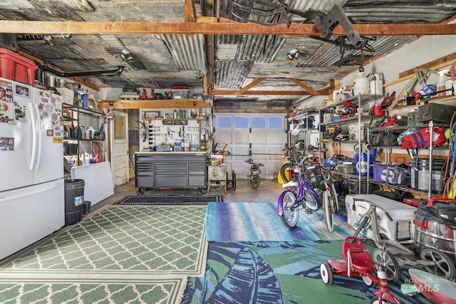 133 N Rd, Jerome, ID 83338 - garage featuring freestanding refrigerator and a workshop area