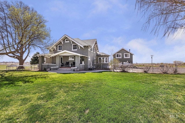 133 N Rd, Jerome, ID 83338 - back of house with fence, a yard, and stucco siding