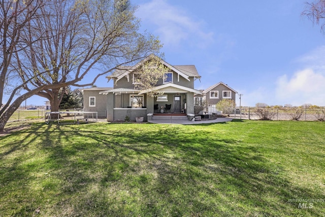 133 N Rd, Jerome, ID 83338 - back of house featuring a yard, a patio area, and fence
