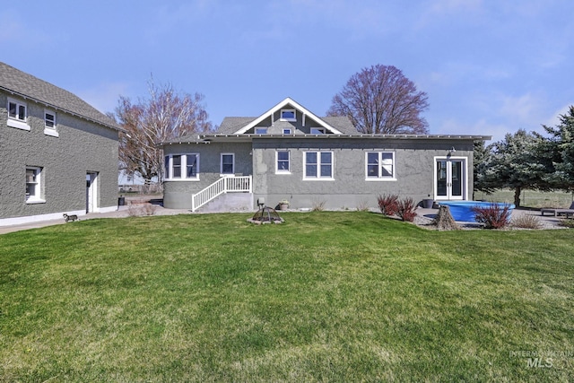 133 N Rd, Jerome, ID 83338 - back of property with a lawn and stucco siding