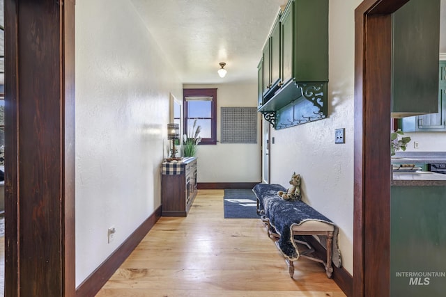 133 N Rd, Jerome, ID 83338 - hall with baseboards, a textured wall, and light wood finished floors