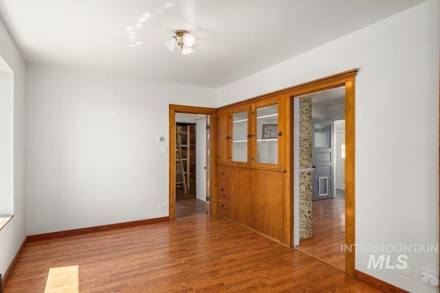 1045 N Beech Rd, Genesee, ID 83832 - empty room featuring baseboards and wood finished floors