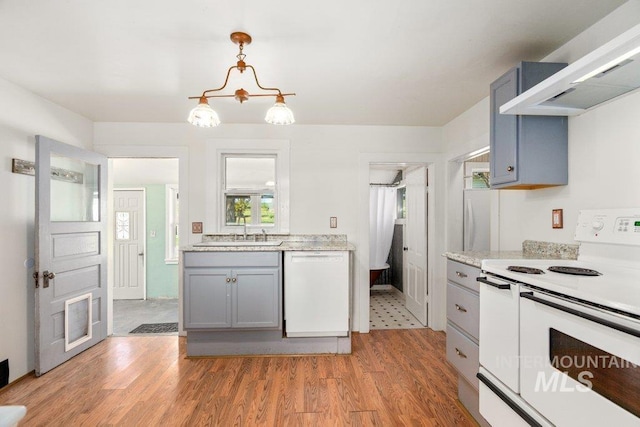 1045 N Beech Rd, Genesee, ID 83832 - kitchen with a sink, white appliances, light wood finished floors, light countertops, and gray cabinetry