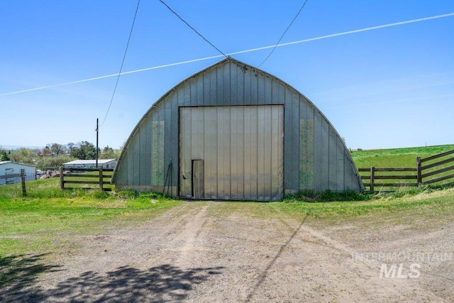 1045 N Beech Rd, Genesee, ID 83832 - view of outdoor structure featuring dirt driveway, an outbuilding, and fence