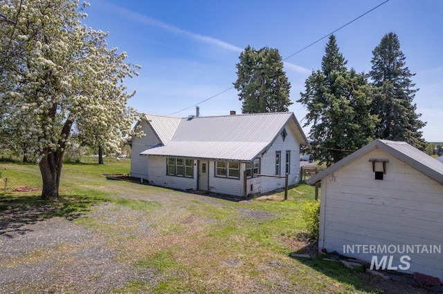 1045 N Beech Rd, Genesee, ID 83832 - view of home's exterior featuring metal roof and a lawn