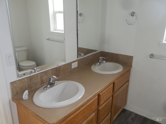 bathroom featuring vanity and toilet