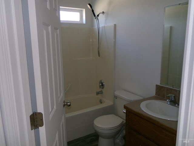 full bathroom with  shower combination, vanity, and toilet