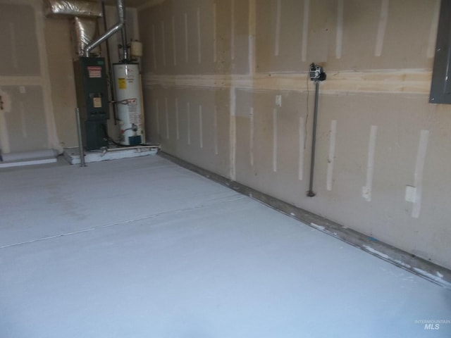 basement with gas water heater and electric panel