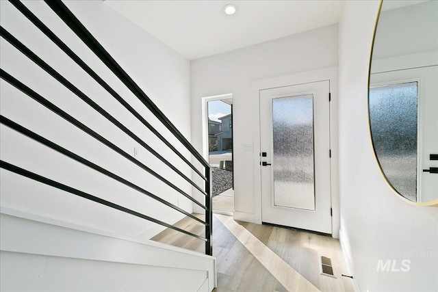 foyer with light wood-type flooring