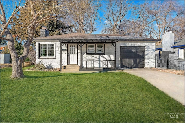 view of front of property with a garage, covered porch, and a front lawn